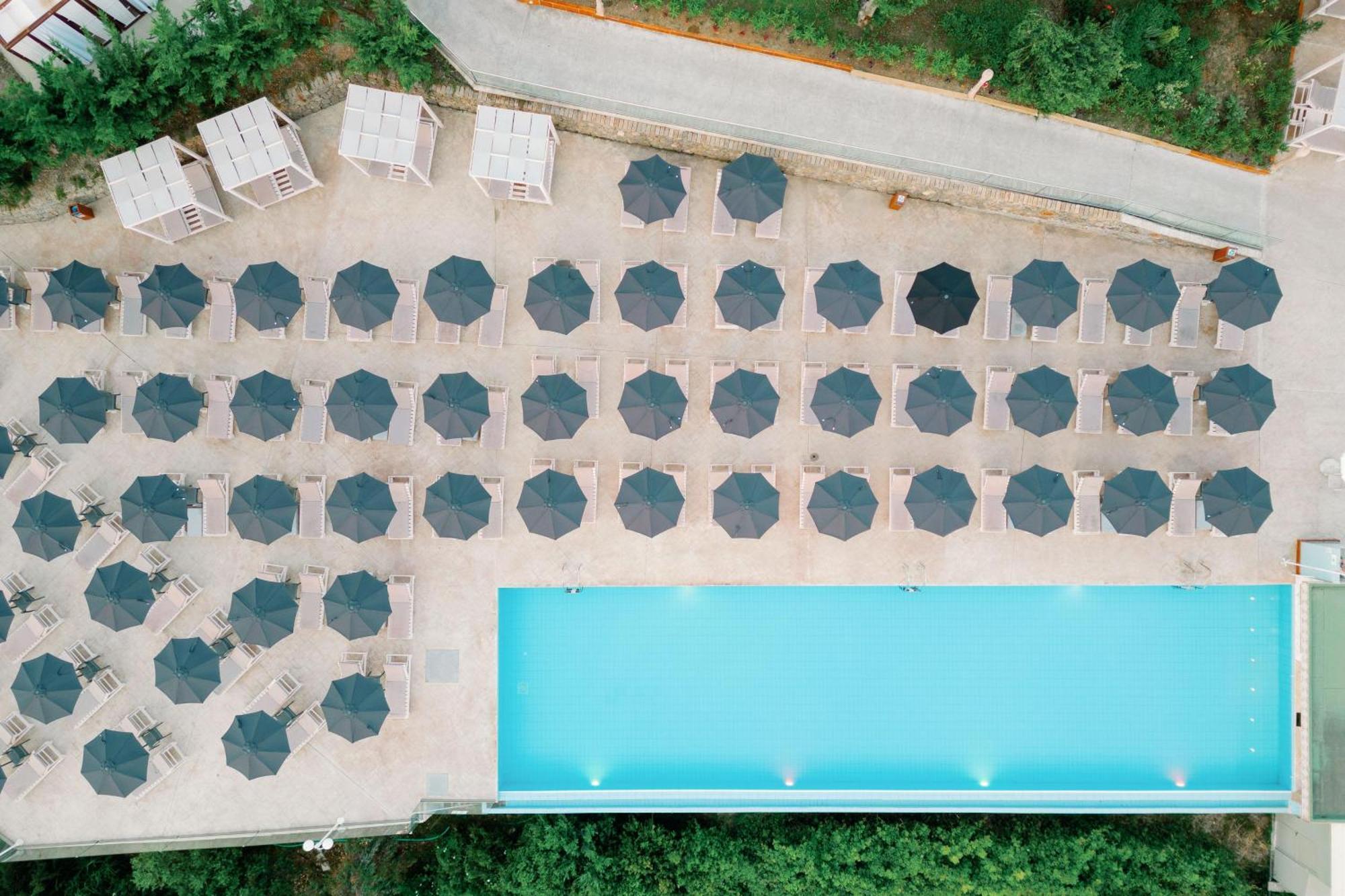 Kairaba Mythos Palace - Adults Only Kouspades Exterior photo Aerial view of a pool